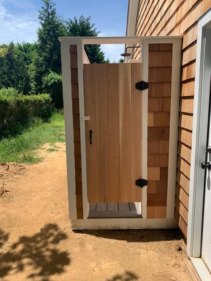 Cedar outdoor shower with a privacy door