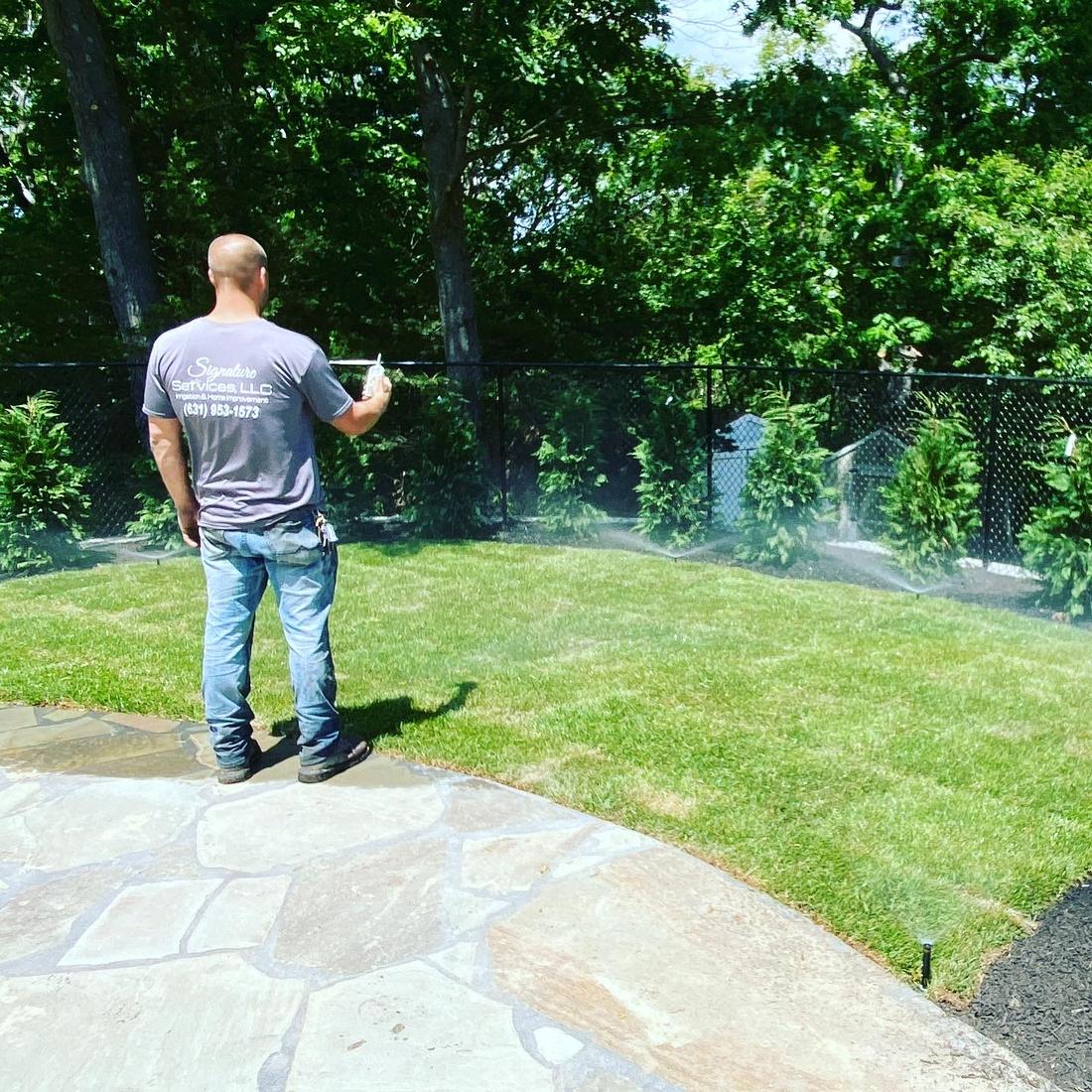 Running sprinkler zones from a phone on a finished lawn